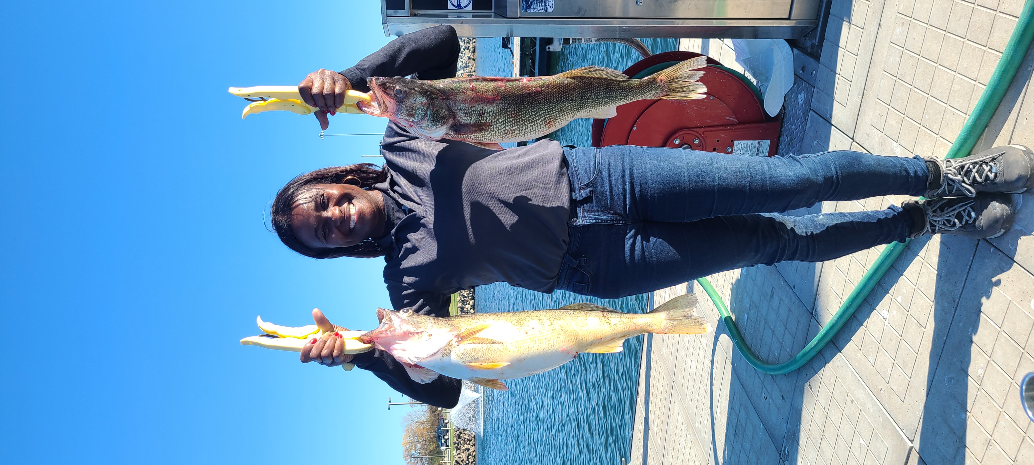 Woman angler walleye dock Cleveland Lake Erie