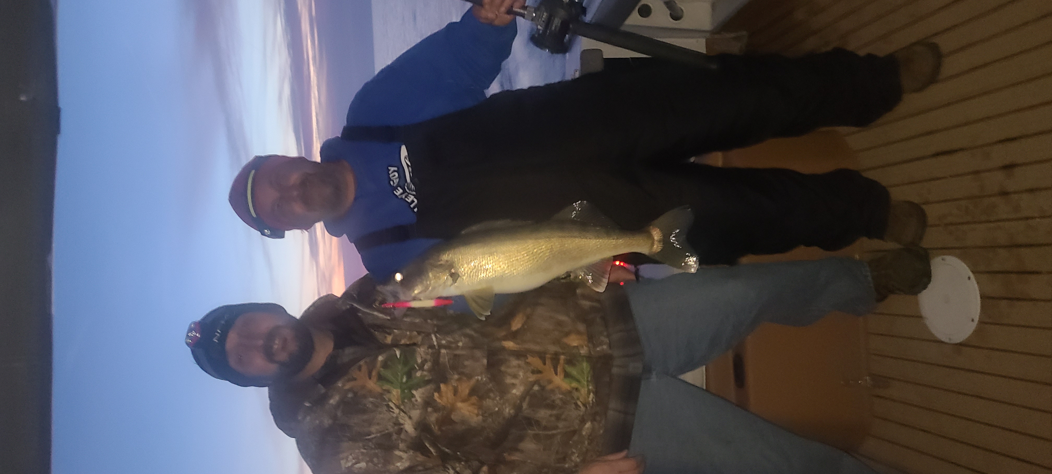 Two anglers big walleye Lake Erie sunset