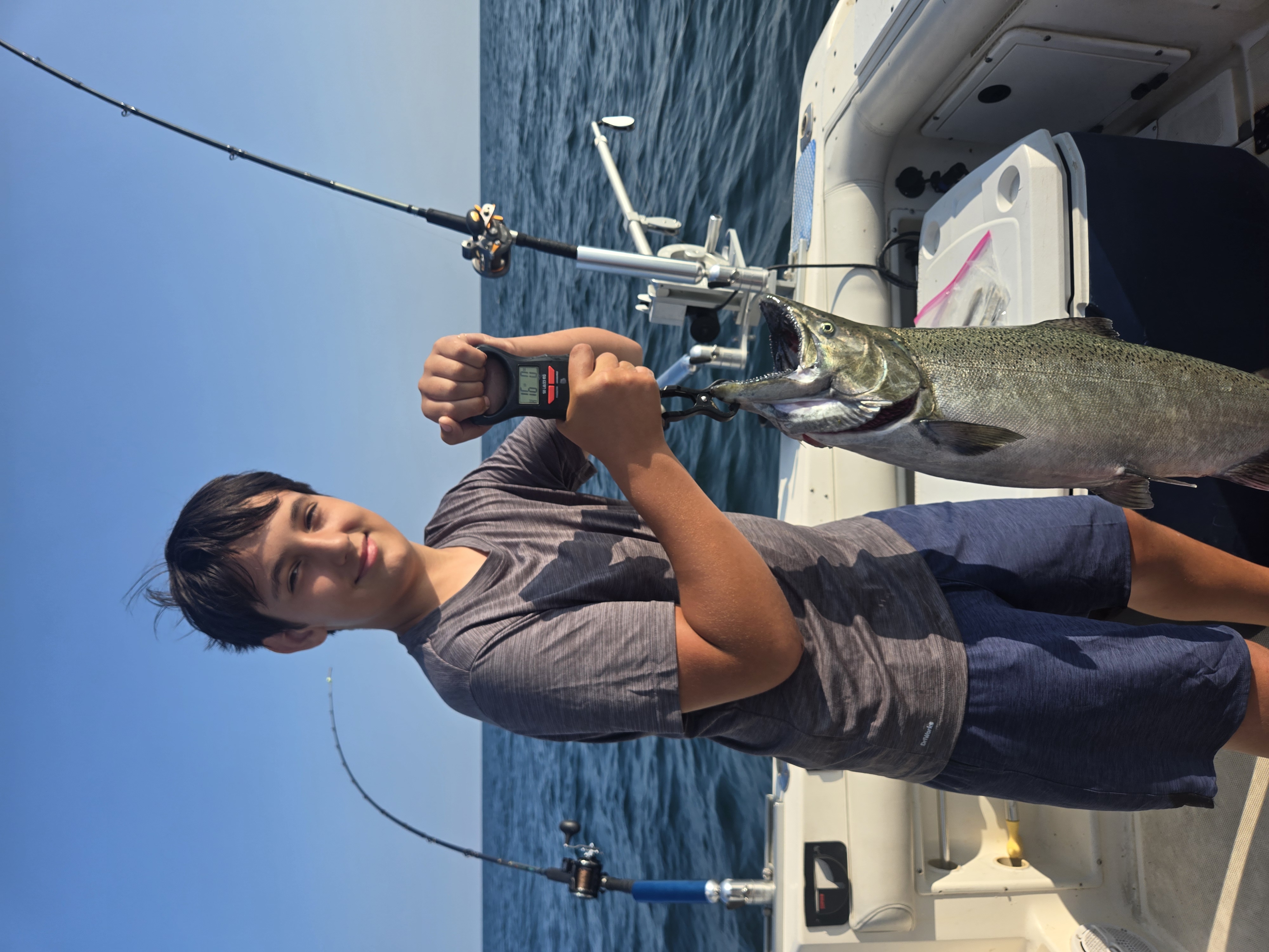 Young angler salmon weigh Lake Ontario
