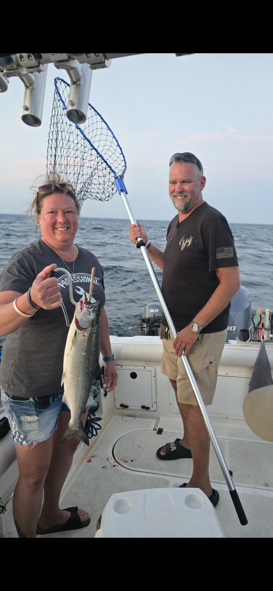 Woman angler salmon Pro-Tek charter Lake Ontario